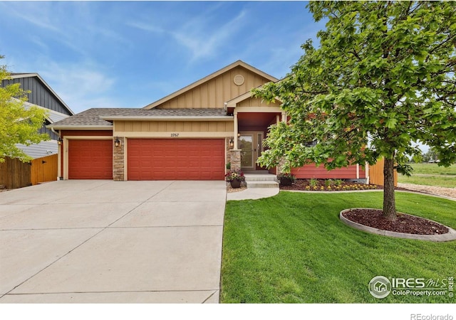 2767 Stallion Way, Mead, CO 80542 - view of front of house with an attached garage, driveway, board and batten siding, and a shingled roof