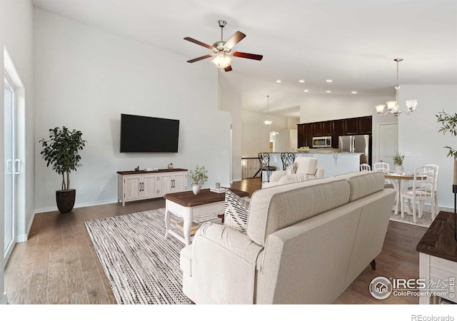 2767 Stallion Way, Mead, CO 80542 - living area featuring ceiling fan, wood finished floors, recessed lighting, baseboards, and a chandelier