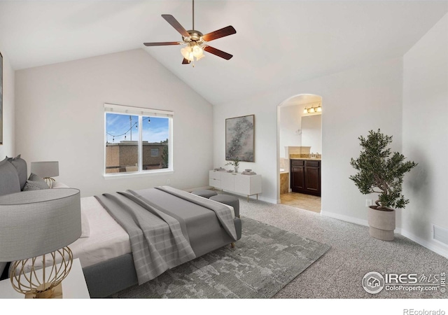 2767 Stallion Way, Mead, CO 80542 - bedroom with carpet floors, arched walkways, lofted ceiling, baseboards, and ensuite bath