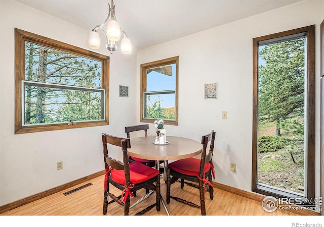 335 Wild Horse Cir, Boulder, CO 80304 - dining room with wood finished floors, baseboards, and healthy amount of natural light