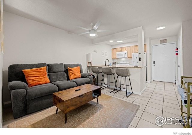 1065 University Ave Unit 121, Boulder, CO 80302 - living room featuring a ceiling fan, light tile patterned flooring, recessed lighting, and baseboards