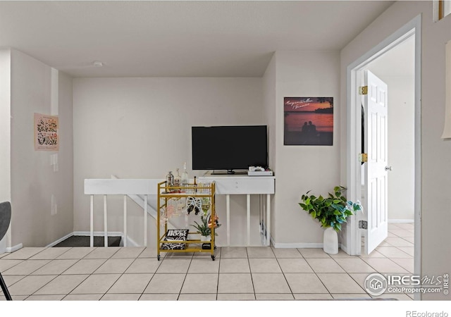 1065 University Ave Unit 121, Boulder, CO 80302 - living room featuring light tile patterned floors and baseboards