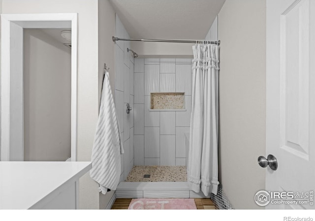 1065 University Ave Unit 121, Boulder, CO 80302 - bathroom with a tile shower and vanity