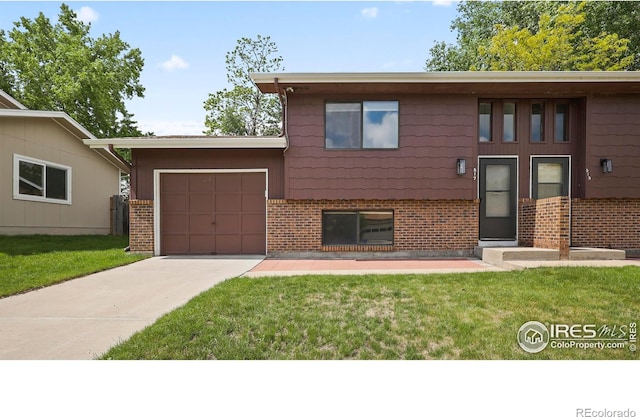 517 46th Ave, Greeley, CO 80634 - view of front of property with driveway, brick siding, and a front yard