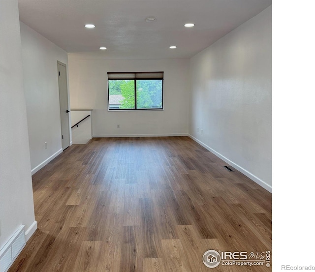 517 46th Ave, Greeley, CO 80634 - spare room featuring wood finished floors, baseboards, and recessed lighting