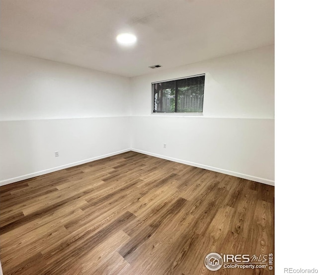517 46th Ave, Greeley, CO 80634 - spare room featuring wood finished floors and baseboards