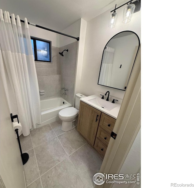 517 46th Ave, Greeley, CO 80634 - full bathroom featuring shower / bath combo, vanity, toilet, and tile patterned floors