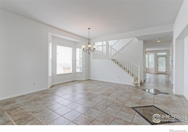 2631 E 136th Pl, Thornton, CO 80602 - spare room featuring a chandelier, stairs, and baseboards