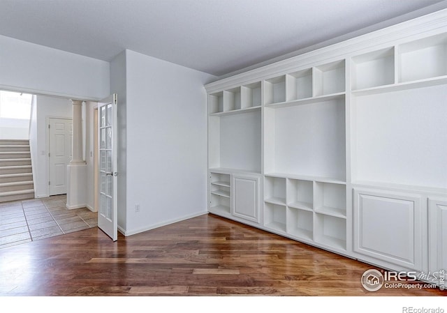 2631 E 136th Pl, Thornton, CO 80602 - unfurnished bedroom with wood finished floors and baseboards