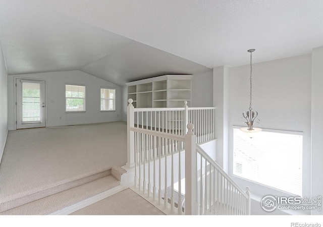 2631 E 136th Pl, Thornton, CO 80602 - hallway with carpet flooring, an upstairs landing, and lofted ceiling