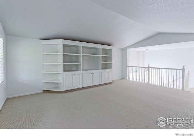 2631 E 136th Pl, Thornton, CO 80602 - spare room featuring carpet floors, vaulted ceiling, and baseboards