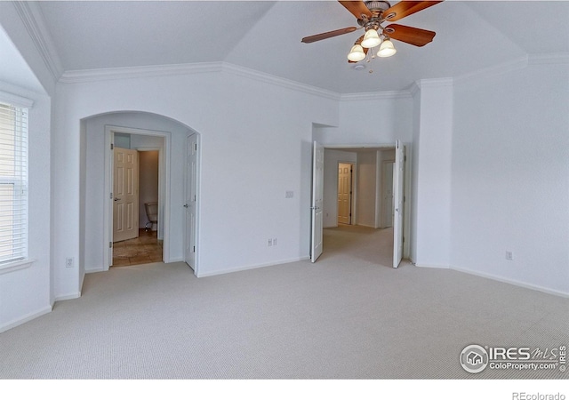 2631 E 136th Pl, Thornton, CO 80602 - unfurnished bedroom with light colored carpet, crown molding, arched walkways, baseboards, and a ceiling fan