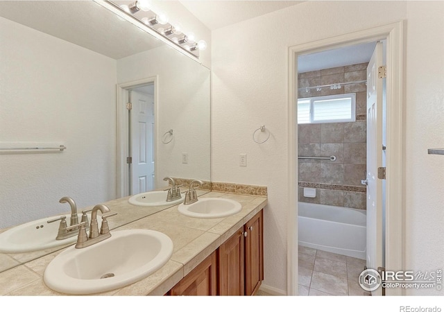 2631 E 136th Pl, Thornton, CO 80602 - full bath with double vanity, washtub / shower combination, and tile patterned flooring
