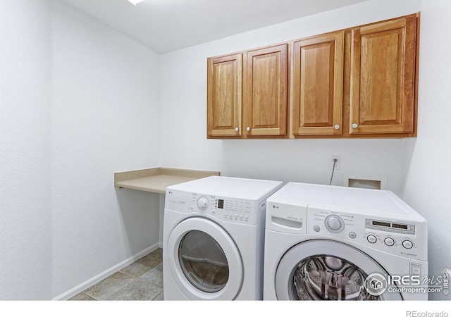 2631 E 136th Pl, Thornton, CO 80602 - laundry room with cabinet space, separate washer and dryer, and baseboards
