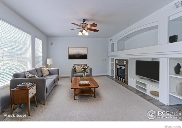2631 E 136th Pl, Thornton, CO 80602 - living room with a ceiling fan, a fireplace, and built in shelves
