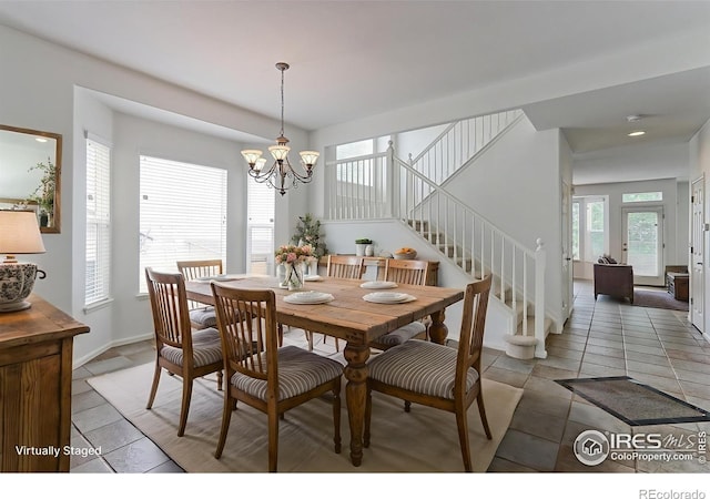 2631 E 136th Pl, Thornton, CO 80602 - dining room with stairs, a chandelier, light tile patterned flooring, and recessed lighting