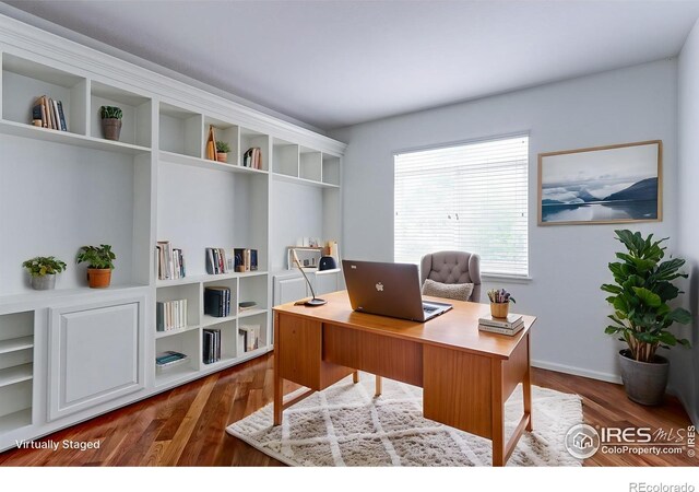 2631 E 136th Pl, Thornton, CO 80602 - office area featuring dark wood-type flooring and baseboards