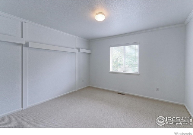 2631 E 136th Pl, Thornton, CO 80602 - unfurnished room featuring carpet, ornamental molding, and a textured ceiling