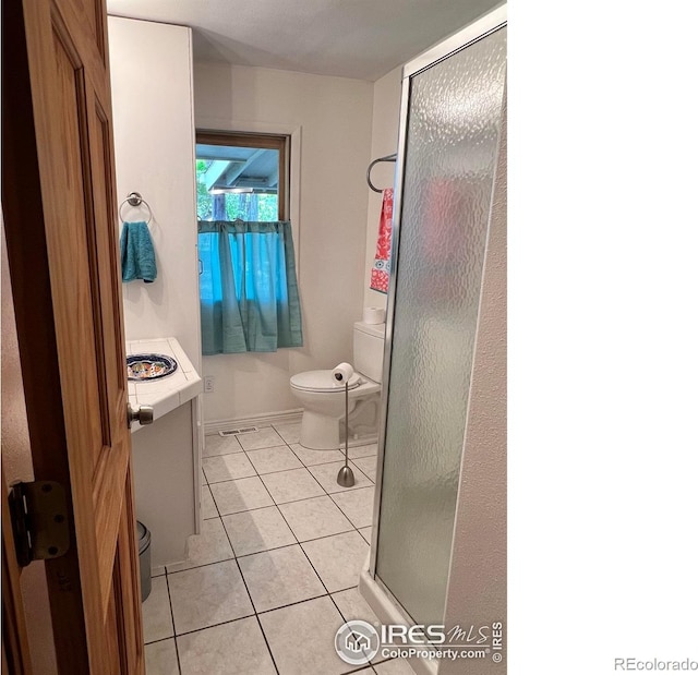 4501 Lawrence Ln, Laporte, CO 80535 - full bath with toilet, a stall shower, and tile patterned floors