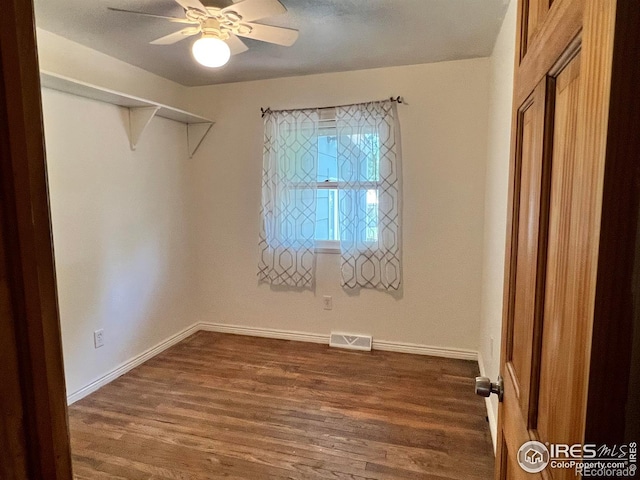 4501 Lawrence Ln, Laporte, CO 80535 - unfurnished bedroom featuring dark wood-style floors, baseboards, and a ceiling fan