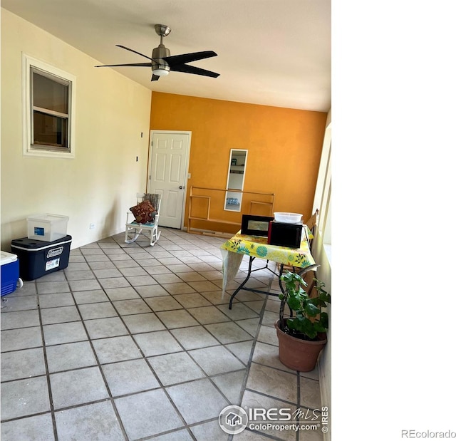 4501 Lawrence Ln, Laporte, CO 80535 - living room featuring a ceiling fan, light tile patterned floors, and vaulted ceiling