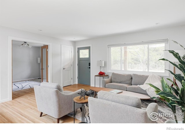 3445 Martin Dr, Boulder, CO 80305 - living area with wood finished floors and baseboards