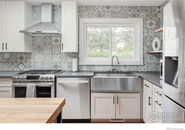 3445 Martin Dr, Boulder, CO 80305 - kitchen featuring wall chimney exhaust hood, stainless steel appliances, a sink, open shelves, and white cabinetry