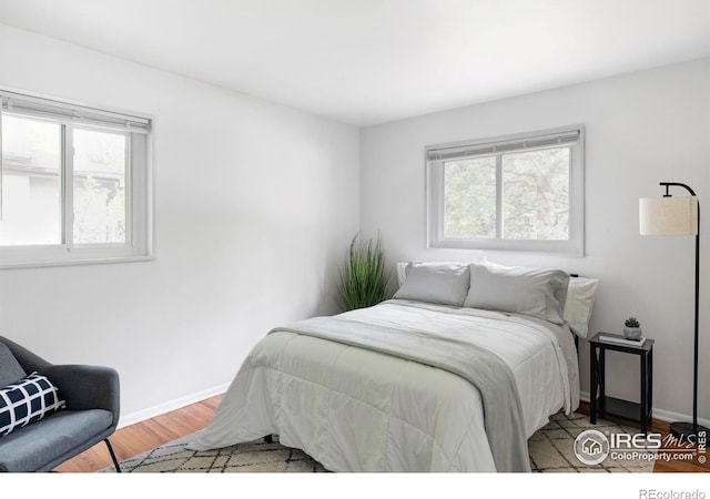 3445 Martin Dr, Boulder, CO 80305 - bedroom with wood finished floors and baseboards