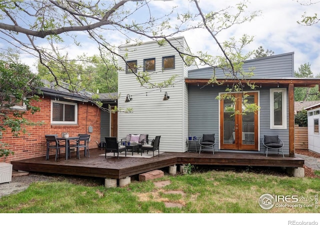 3445 Martin Dr, Boulder, CO 80305 - back of property featuring french doors, a deck, an outdoor hangout area, and a yard