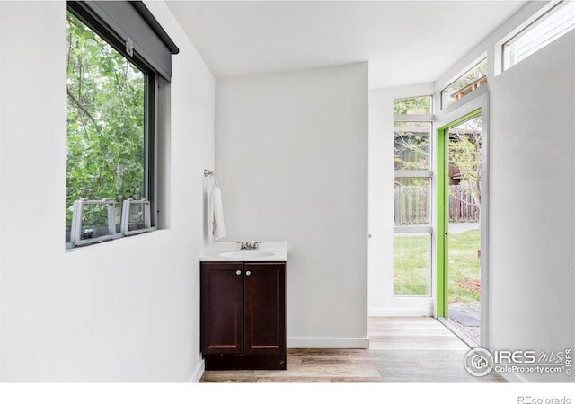 3445 Martin Dr, Boulder, CO 80305 - bathroom with vanity, wood finished floors, and baseboards