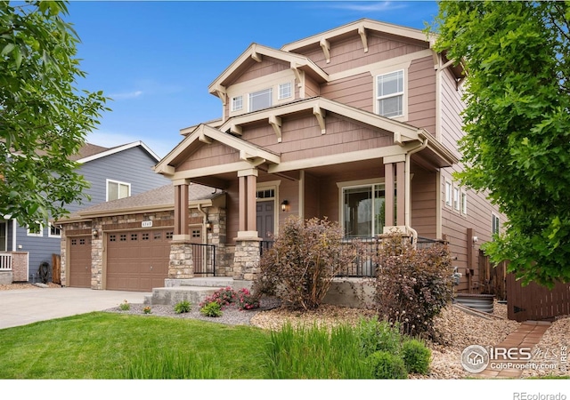 6340 Spring Valley Rd, Timnath, CO 80547 - craftsman house with a garage, concrete driveway, a front yard, and covered porch