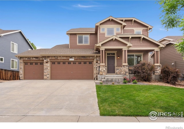 6340 Spring Valley Rd, Timnath, CO 80547 - craftsman-style home with a porch, concrete driveway, stone siding, and an attached garage