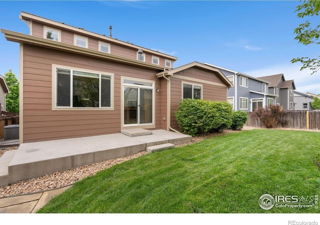 6340 Spring Valley Rd, Timnath, CO 80547 - back of house featuring a patio and central AC unit