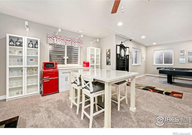 5512 Bristow Rd, Timnath, CO 80547 - dining room featuring light carpet, baseboards, ceiling fan, and recessed lighting