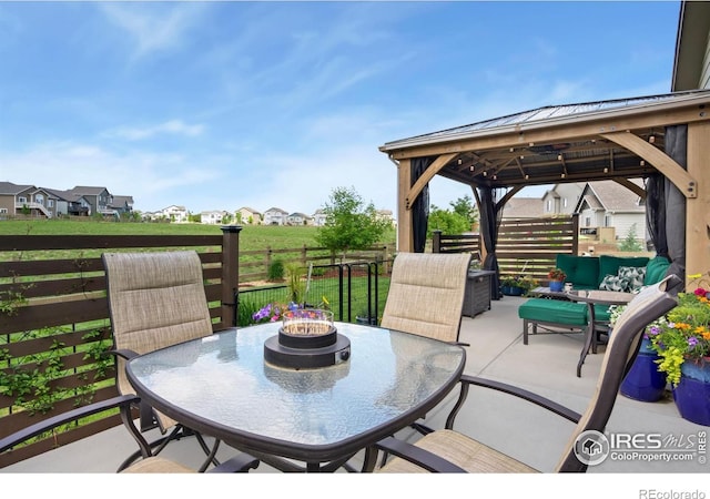 5512 Bristow Rd, Timnath, CO 80547 - view of patio with a gazebo, outdoor dining space, and a residential view