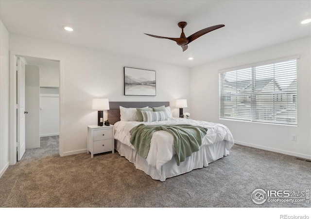 645 Flintwood Pl, Lafayette, CO 80026 - carpeted bedroom featuring recessed lighting, baseboards, a walk in closet, and a ceiling fan