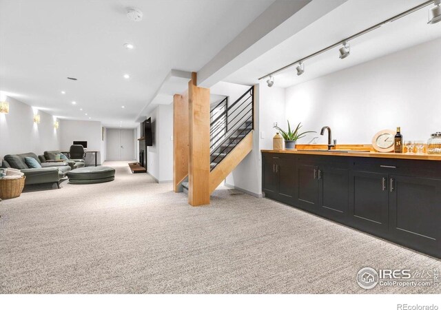 205 Lipan Way, Boulder, CO 80303 - carpeted living area featuring stairway, recessed lighting, baseboards, and bar area