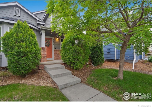 2633 Rock Creek Dr, Fort Collins, CO 80528 - view of exterior entry featuring brick siding