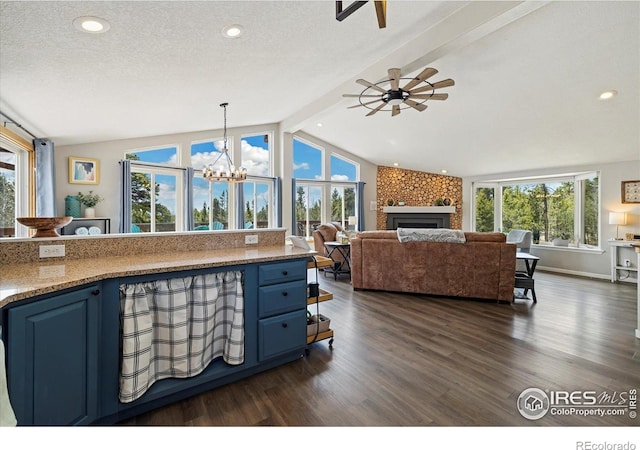 1954 Bluestem Way, Fairplay, CO 80440 - kitchen featuring blue cabinetry, healthy amount of natural light, dark wood-style flooring, recessed lighting, and a textured ceiling