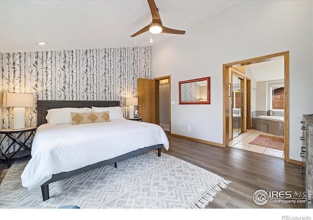 1954 Bluestem Way, Fairplay, CO 80440 - bedroom featuring baseboards, lofted ceiling, wood finished floors, ensuite bath, and recessed lighting