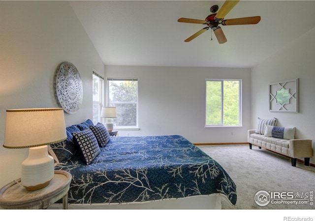 804 Nelson Park Ln, Longmont, CO 80503 - carpeted bedroom featuring lofted ceiling, baseboards, and a ceiling fan