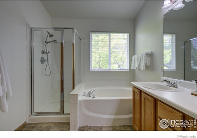 804 Nelson Park Ln, Longmont, CO 80503 - bathroom with a bath, vanity, and a stall shower