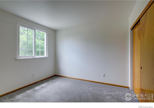 804 Nelson Park Ln, Longmont, CO 80503 - carpeted spare room featuring baseboards