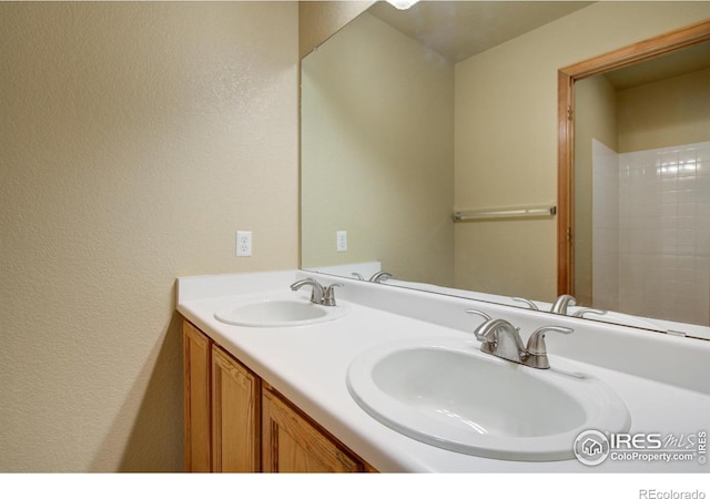 804 Nelson Park Ln, Longmont, CO 80503 - full bath featuring double vanity and a textured wall