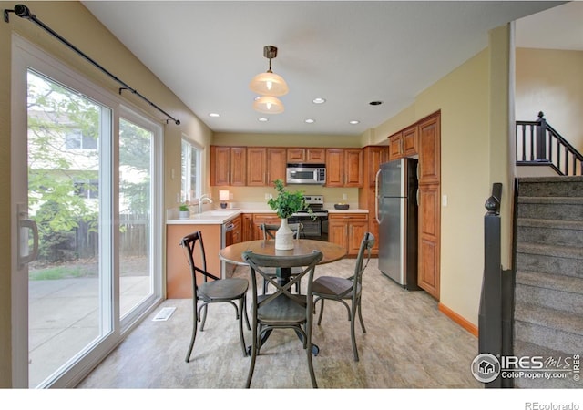 804 Nelson Park Ln, Longmont, CO 80503 - dining space featuring stairs and recessed lighting