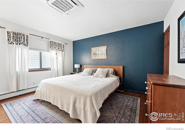 3255 34th St Unit 42, Boulder, CO 80301 - bedroom with wood finished floors and an accent wall