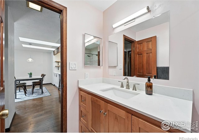 3255 34th St Unit 42, Boulder, CO 80301 - full bath featuring vanity, wood finished floors, a skylight, and a shower