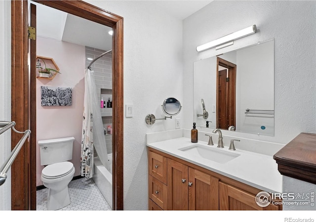 3255 34th St Unit 42, Boulder, CO 80301 - full bath with vanity, toilet, shower / bath combo, a textured wall, and tile patterned floors