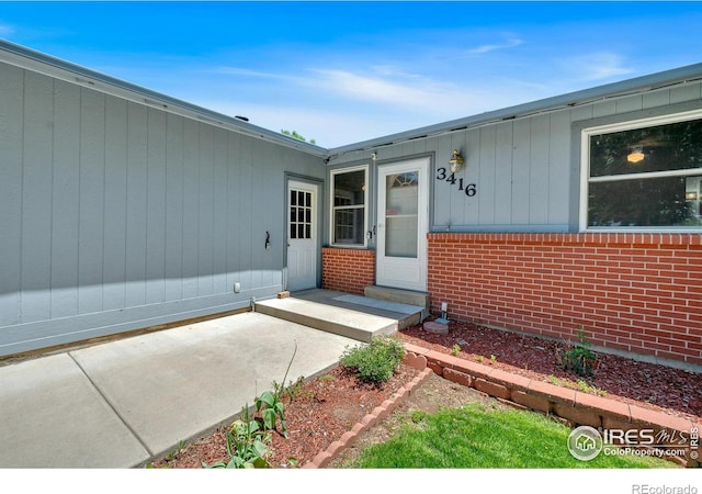 3416 Logan Ave, Loveland, CO 80538 - property entrance featuring brick siding