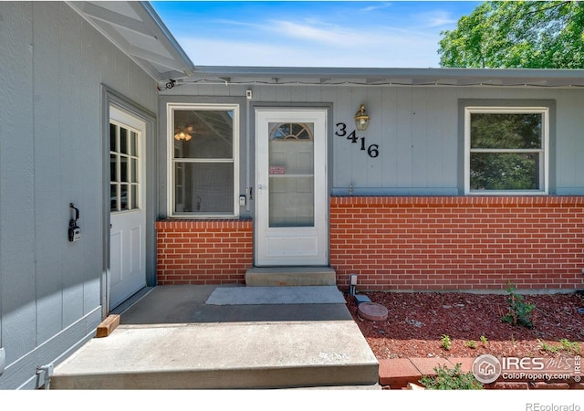 3416 Logan Ave, Loveland, CO 80538 - doorway to property with brick siding